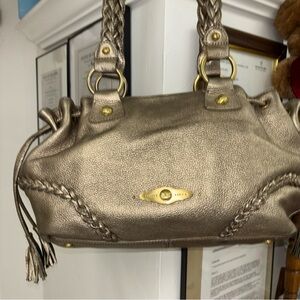 Elliott Lucca gold hand bag with tag